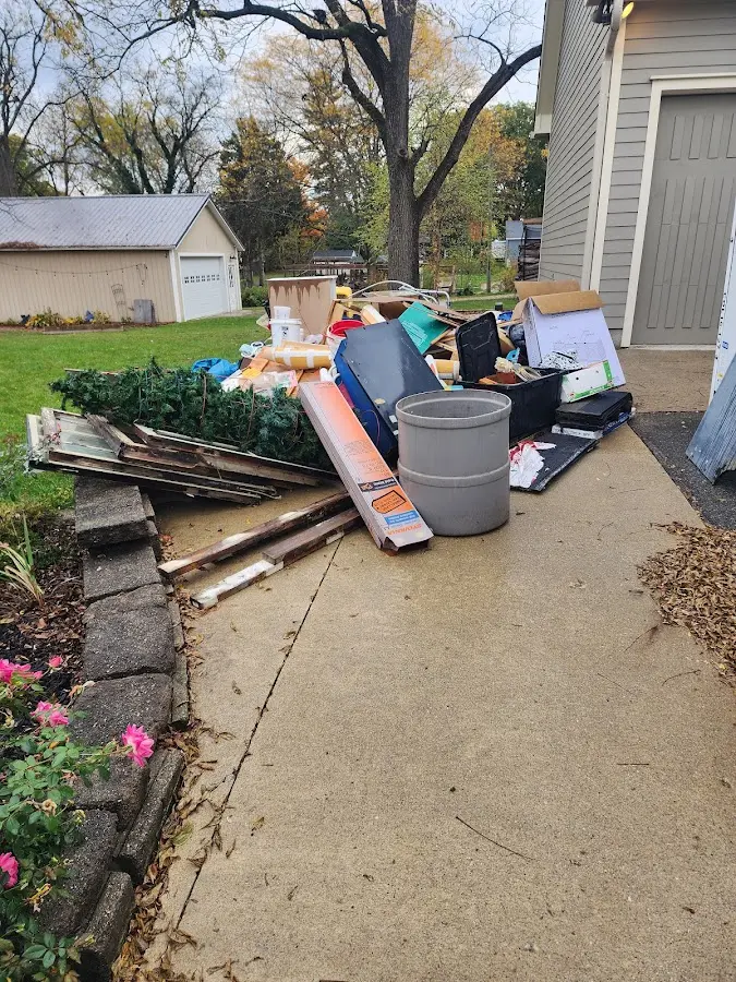 Dumpster being loaded with debris for 3 Yard Dumpster Rental in Harrodsburg